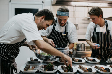 Dennis, Mitja and Sam plating the main course, Lord Howe Island