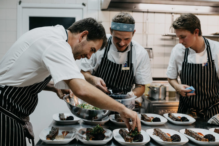 Dennis, Mitja and Sam plating the main course, Lord Howe Island