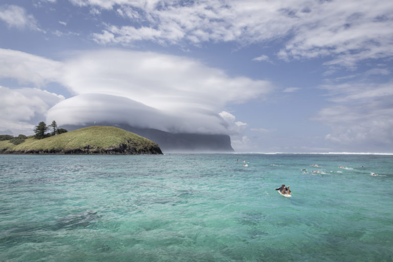 A lifeguard watches swimmers in the Lord Howe Lagoon