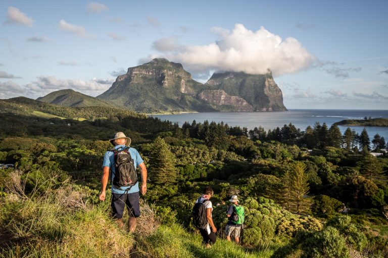 Walkers descending towards the CBD after a long day, Lord Howe Island