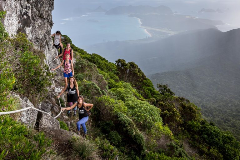 The Pinetrees girls en route to Goat House through a heavy shower, Lord Howe Island
