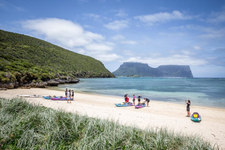 Kayakers land at North Bay, Lord Howe Island