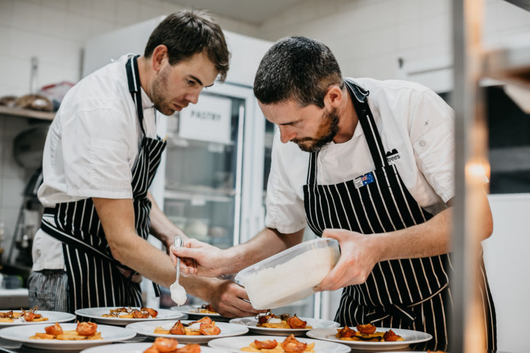 Al and Dennis working on a main course dish, Lord Howe Island