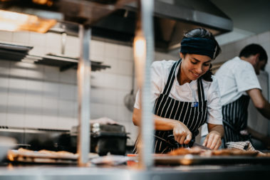Lara at work in the kitchen, Lord Howe Island