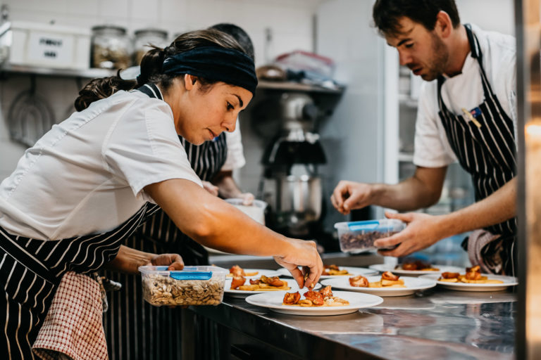 Lara and Dennis adding components to each dish, Lord Howe Island